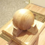 Wooden sphere on a staircase banister
