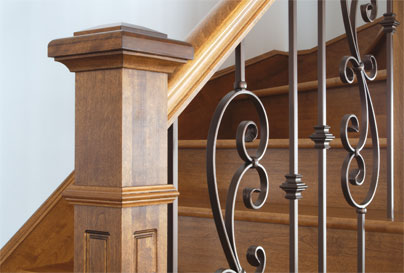 Wooden accent post on wood staircase