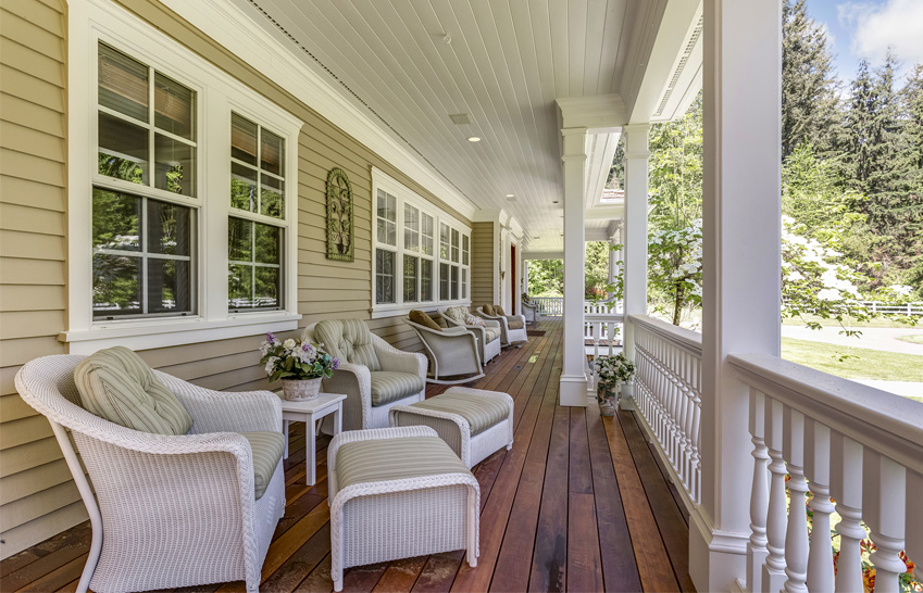 Luxury wooden porch columns on deck boards