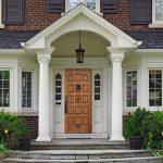 grand entrance with wood porch columns