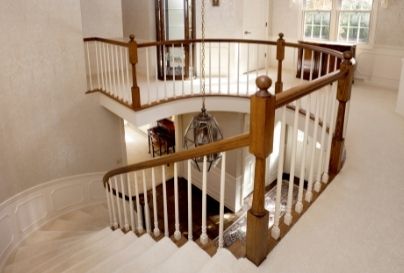 Round traditional newel post in foyer